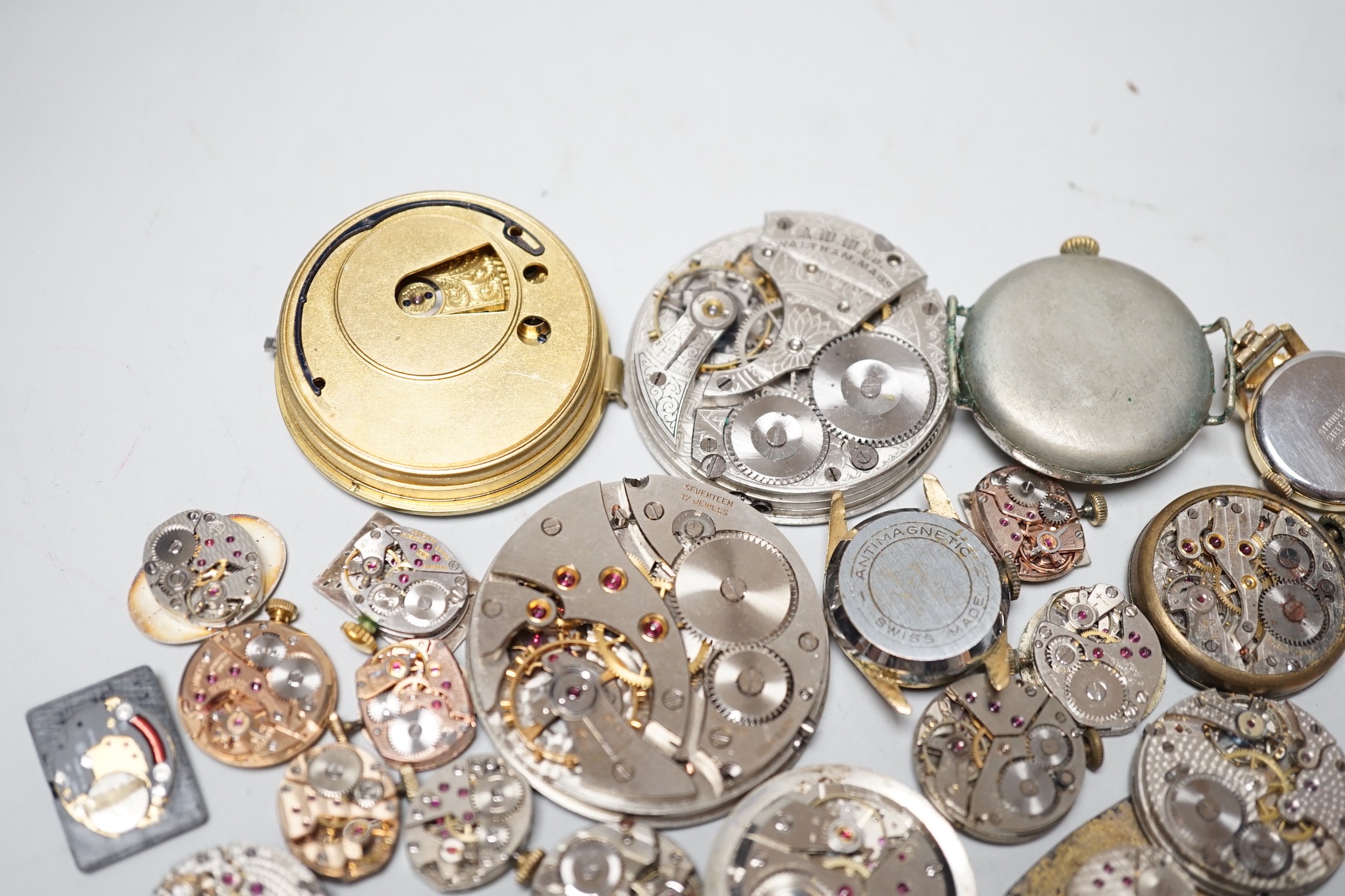 A collection of assorted wrist and pocket watch parts.